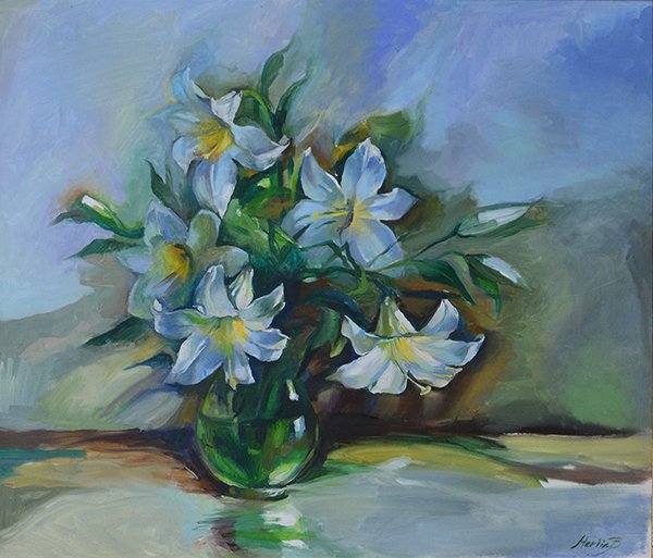 white lilies in a transparent vase